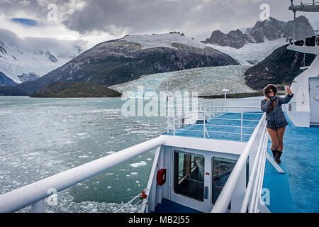 Woman,Tourist, selfie, Pia Fjord and Pia Glacier from Ventus cruise ship, in Beagle Channel (northwest branch), PN Alberto de Agostini, Tierra del Fue Stock Photo