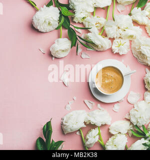 Flat-lay of cup of coffee and ranunculus flowers, square crop Stock Photo