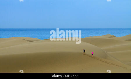 Tourists travel through the dunes in the Maspalomas. Stock Photo