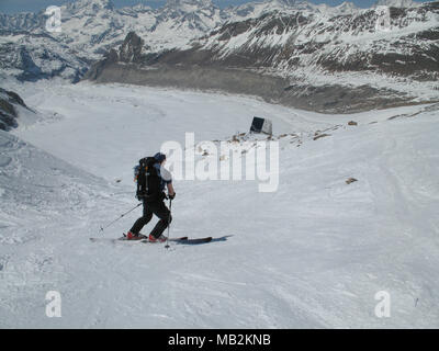 male backcountr skier on a huge glacier during a wonderful ski descent during late spring Stock Photo