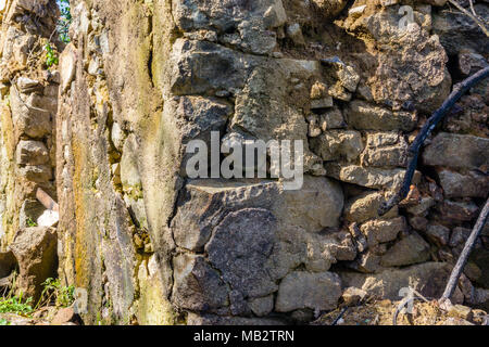 Dry stone wall made of random grey stone Stock Photo