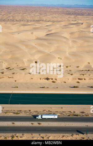 AERIAL VIEW. All American Canal alongside Interstate 8 in the Algodones Dunes in the Sonoran Desert. Winterhaven, Imperial County, California, USA. Stock Photo