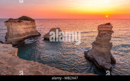 Meledugno town in Italy, Puglia Region. Spectacular view at sunrise on Santo Andrea cliffs Stock Photo