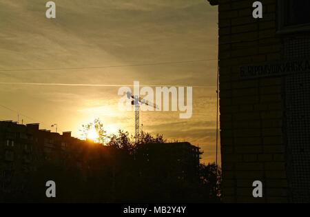 construction crane at sunset in Moscow, Russia Stock Photo