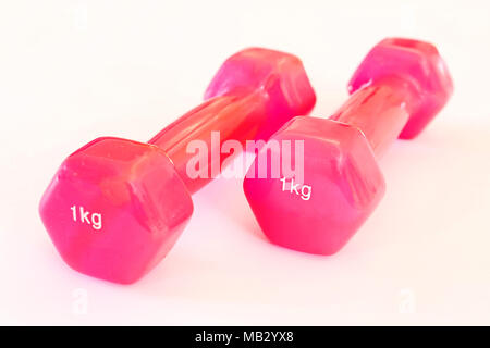 1 KG pink dumbbells isolated on a white background. Studio shot Stock Photo