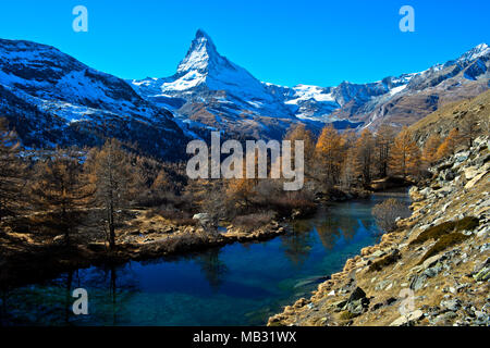 Lake Grindjesee in autumn, with view of the snow-covered Matterhorn, Zermatt, Valais, Switzerland Stock Photo