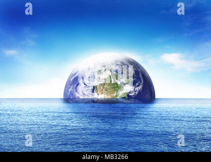 Birth of the world or doomsday scene, sinking earth globe or planet earth. Blue sea and beautiful world globe rising. Stock Photo