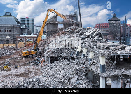 Excavator in building rubble during demolition of a building, Nuremberg, Middle Franconia, Bavaria, Germany Stock Photo