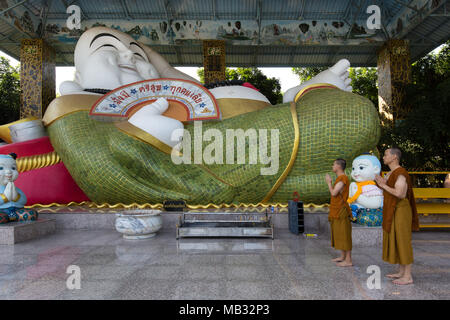 Monks in front of a Chinese Buddha, Wat Pa Thamma Utthayan, Khon Kaen, Isan, Thailand Stock Photo