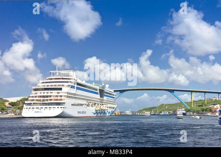 Cruise liner ship AIDA diva docked at Santa Anna Bay, Otrobanda district, with Queen Juliana bridge, Willemstad, Curacao, January 2018 Stock Photo