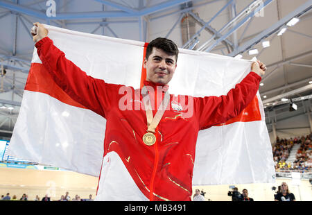 England's Charlie Tanfield celebrates with his gold medal in the Men's 4000m Individual Pursuit Finals - Gold at the Anna Meares Velodrome during day two of the 2018 Commonwealth Games in the Gold Coast, Australia. PRESS ASSOCIATION Photo. Picture date: Friday April 6, 2018. See PA story COMMONWEALTH Cycling Track. Photo credit should read: Martin Rickett/PA Wire. RESTRICTIONS: Editorial use only. No commercial use. No video emulation. Stock Photo