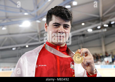 England's Charlie Tanfield celebrates with his gold medal in the Men's 4000m Individual Pursuit Finals - Gold at the Anna Meares Velodrome during day two of the 2018 Commonwealth Games in the Gold Coast, Australia. PRESS ASSOCIATION Photo. Picture date: Friday April 6, 2018. See PA story COMMONWEALTH Cycling Track. Photo credit should read: Martin Rickett/PA Wire. RESTRICTIONS: Editorial use only. No commercial use. No video emulation. Stock Photo