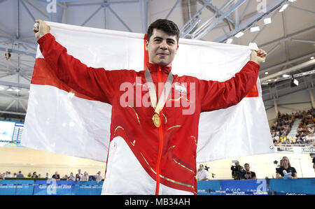 England's Charlie Tanfield celebrates with his gold medal in the Men's 4000m Individual Pursuit Finals - Gold at the Anna Meares Velodrome during day two of the 2018 Commonwealth Games in the Gold Coast, Australia. PRESS ASSOCIATION Photo. Picture date: Friday April 6, 2018. See PA story COMMONWEALTH Cycling Track. Photo credit should read: Martin Rickett/PA Wire. RESTRICTIONS: Editorial use only. No commercial use. No video emulation. Stock Photo