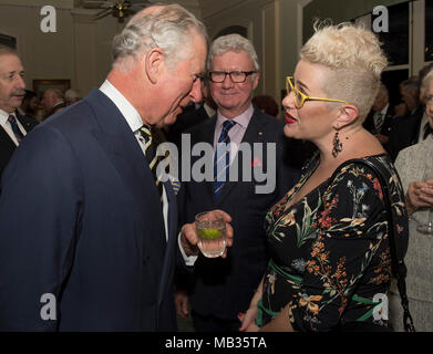 The Prince of Wales talks to singer Katie Noonan, during a reception hosted by the Governor of Queensland His Excellency The Honourable Paul de Jersey AC at Government House in Queensland, Australia. Stock Photo