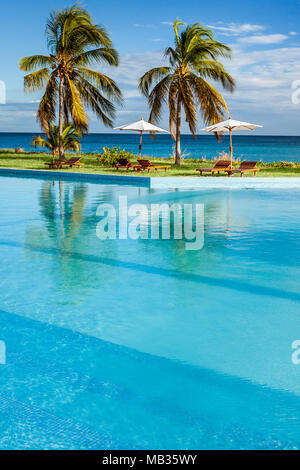 Swimming pool overlooking the sea in a tropical hotel Stock Photo