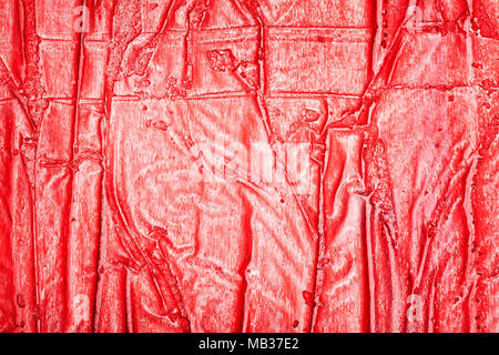 Red bumpy wall stucco texture background, crumpled leather imitation Stock Photo