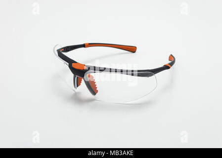 Safety glasses in black and orange color on white background isolation Stock Photo