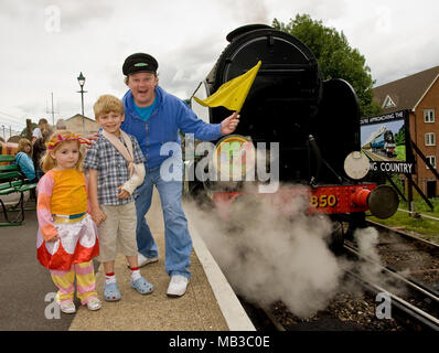 Justin Fletcher AKA Mr Tumble from cbeebies launches the Ninky Nonk as part of a children's day out to celebrate In The Night Garden childrens TV show, the event was held at the Watercress line steam railway in Hampshire England. With one of the centres steam trains and carriages themed as the characters and settings of the popular show complete with on board readings and games. Stock Photo