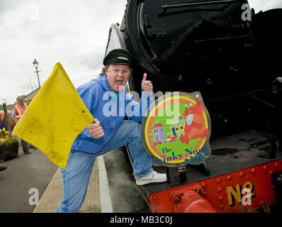 Justin Fletcher AKA Mr Tumble from cbeebies launches the Ninky Nonk as part of a children's day out to celebrate In The Night Garden childrens TV show, the event was held at the Watercress line steam railway in Hampshire England. With one of the centres steam trains and carriages themed as the characters and settings of the popular show complete with on board readings and games. Stock Photo