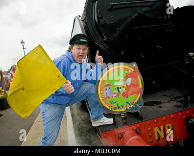 Justin Fletcher AKA Mr Tumble from cbeebies launches the Ninky Nonk as part of a children's day out to celebrate In The Night Garden childrens TV show, the event was held at the Watercress line steam railway in Hampshire England. With one of the centres steam trains and carriages themed as the characters and settings of the popular show complete with on board readings and games. Stock Photo