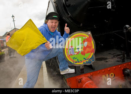 Justin Fletcher AKA Mr Tumble from cbeebies launches the Ninky Nonk as part of a children's day out to celebrate In The Night Garden childrens TV show, the event was held at the Watercress line steam railway in Hampshire England. With one of the centres steam trains and carriages themed as the characters and settings of the popular show complete with on board readings and games. Stock Photo