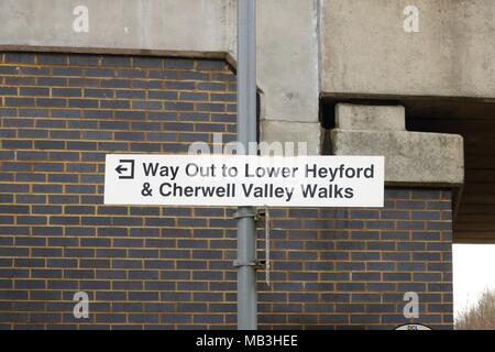 'Way Out to Lower Heyford & Cherwell Valley Walks' white sign showing directions outside Heyford Railway Station, Oxfordshire, UK Stock Photo
