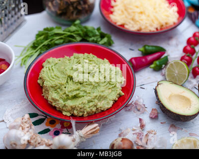 Home made Guacamole in Mexican style kitchen Stock Photo