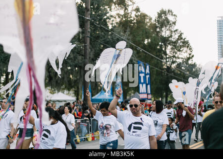 Pulse supporters march in Orlando Pride Parade with angels to remember and honor each of the victims in the Pulse shooting (2016). Stock Photo