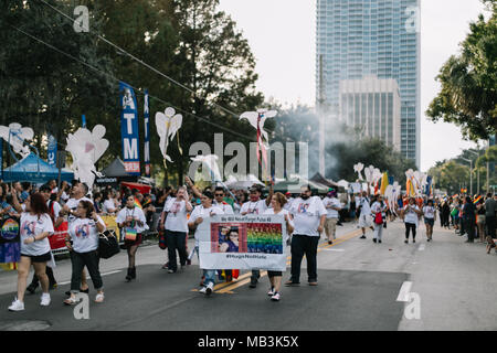 Pulse supporters march in Orlando Pride Parade with angels to remember and honor each of the victims in the Pulse shooting (2016). Stock Photo