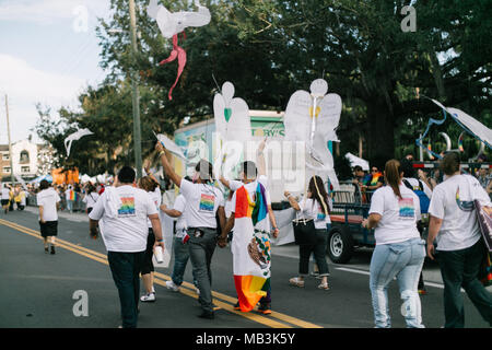 Pulse supporters march in Orlando Pride Parade with angels to remember and honor each of the victims in the Pulse shooting (2016). Stock Photo