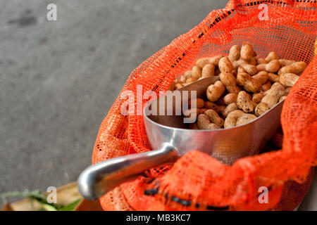 Scooper Full Of Peanuts Sits In Bag At Farmers Market Stock Photo