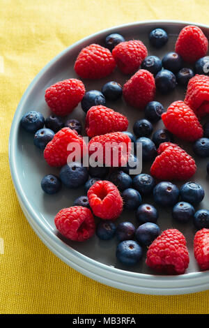 Fresh Raspberries and Blueberries Stock Photo