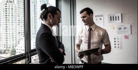 Stressed businessman in the office.business, teamwork, people and crisis concept - business team sad and solving problem Stock Photo