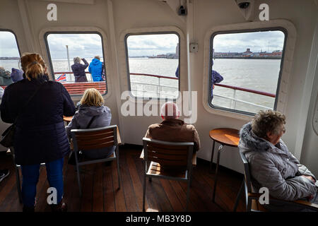 Passengers in the front lounge of the Mersey Ferry Royal Iris Stock Photo