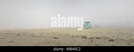 Early morning fog surrounds a life guard station on the beach in Santa Monica, California. Stock Photo