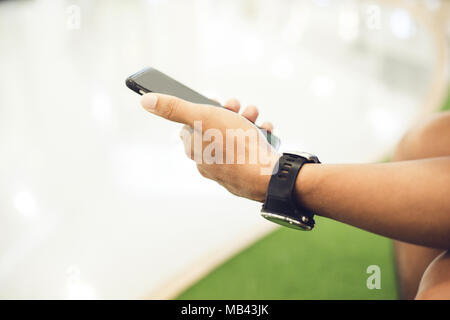 man asian using phone for celling and texting on her mobile phone Stock Photo