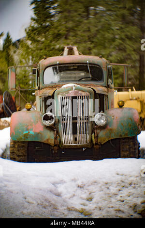 A 1942 White Super Power 2 1/2 ton winch truck in a wooded area, in Noxon, Montana  This image was shot with an antique Petzval lens and will show sig Stock Photo