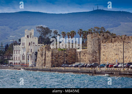 Kos Town with choppy sea. Ancient city walls and town hall, Kos Greece Stock Photo