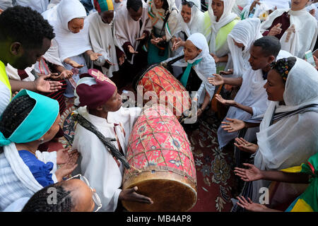 Ethiopian Orthodox worshipers playing the Kebero a double-headed ...