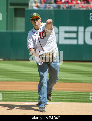 Washington, District of Columbia, USA. 5th Apr, 2018. The ceremonial first pitch is thrown by Deputy First Class Blaine Gaskill of the St. Mary's County, Maryland Sheriff's Office and Great Mills High School, where Gaskill heroically brought the active shooter incident to a quick end on March 20, 2018 prior to the game against the New York Mets at Nationals Park in Washington, DC on Thursday, April 5, 2018.Credit: Ron Sachs/CNP. Credit: Ron Sachs/CNP/ZUMA Wire/Alamy Live News Stock Photo