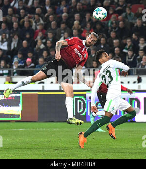 06 April 2018, Germany, Hannover: Soccer Bundesliga, Hannover 96 vs Werder Bremen in the HDI Arena: Hannover's Martin Harnik (L) heading the ball away from Werder's Theodor Gebre Selassie. Photo: Peter Steffen/dpa - IMPORTANT NOTICE: Due to the German Football League·s (DFL) accreditation regulations, publication and redistribution online and in online media is limited during the match to fifteen images per match Credit: dpa picture alliance/Alamy Live News Stock Photo