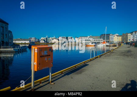 Beautiful summer view of Alesund port town on the west coast of Norway, at the entrance to the Geirangerfjord. Colorful sunset in the Nord. Traveling concept background. Stock Photo