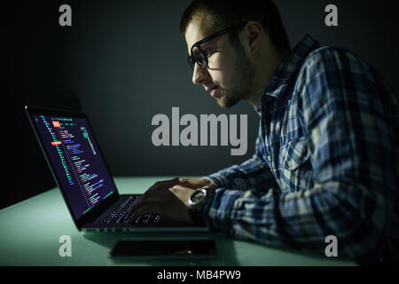Hacker attack the server in the dark. Hacker attack network and servers, codec and virus. Stock Photo