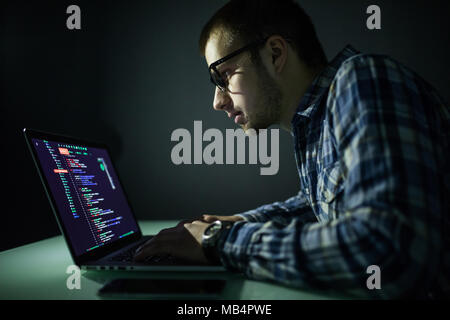 Hacker attack the server in the dark. Hacker attack network and servers, codec and virus. Stock Photo