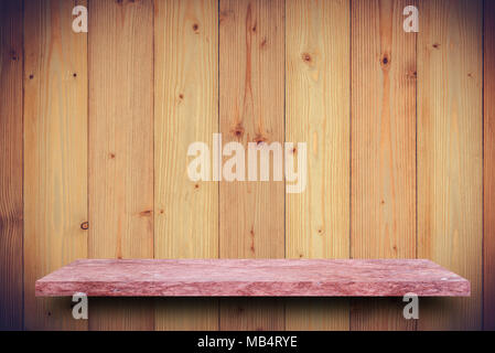 Empty top of pink  marble stone table on wooden plank wall background. For product display Stock Photo