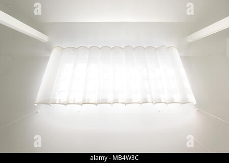 roof window with white curtains in bright interior Stock Photo