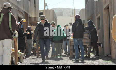 Keith Sledd, executive director for Heart of Texas Defense Alliance, walks through the simulated market place located in the fictitious town of Razish at the National Training Center in Fort Irwin, Calif., Feb. 18, 2018. The Killeen and Harker Heights Chambers of Commerce NTC visit is designed to strengthen relationships between civic leaders in the surrounding Fort Hood community and service members assigned to Fort Hood, Texas. Stock Photo