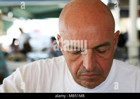 Bald man with white shirt Stock Photo
