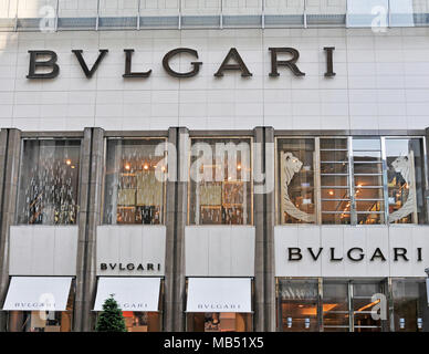 Tokyo, Ginza at golden hour. View along street, Louis Vuitton and the  Bvlgari flagship store buildings with taxis waiting at red stop light in  front Stock Photo - Alamy