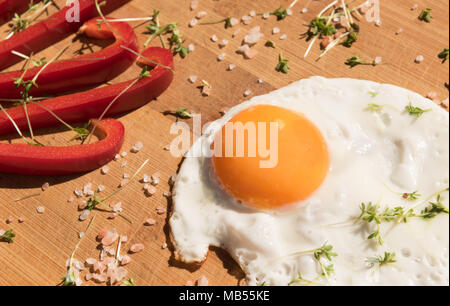 fried egg on a drained background Stock Photo